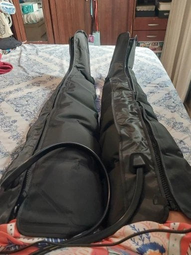 Customer photo of the Long compression boots on a bed